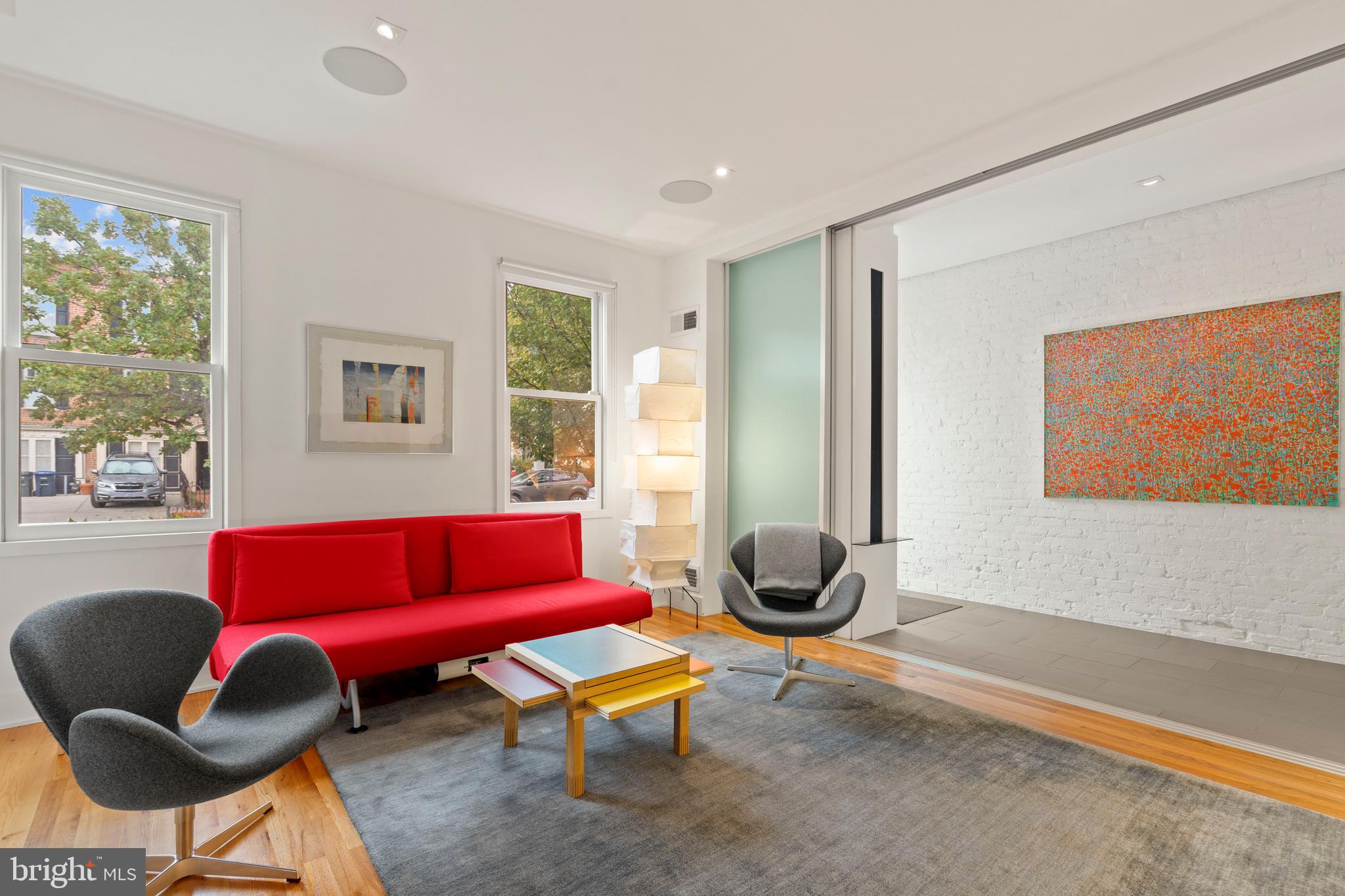 633 E Street Southeast Washington, DC 20003 - Photo 5 of 52 a living room with furniture a rug and a large window