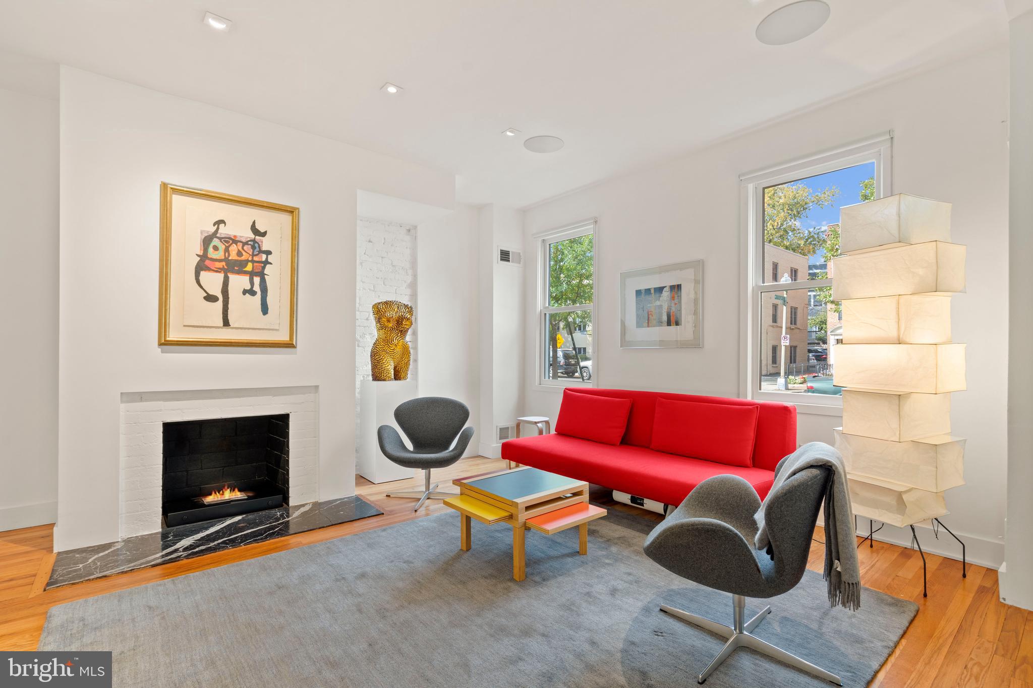 633 E Street Southeast Washington, DC 20003 - Photo 6 of 52 a living room with furniture a rug and a fireplace