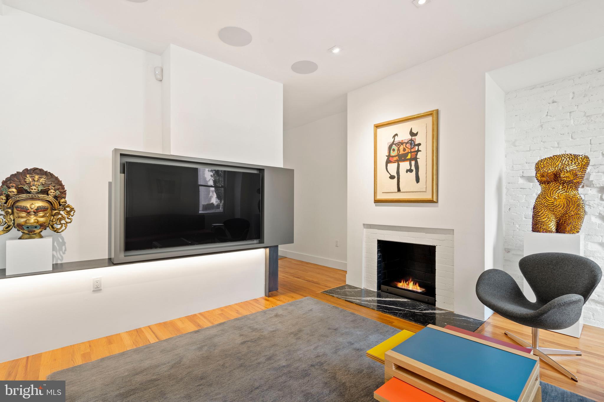 633 E Street Southeast Washington, DC 20003 - Photo 7 of 52 a living room with furniture and a fireplace