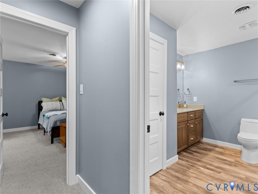 11390 Rocky Ridge Road Glen Allen, VA 23059 - Photo 72 of 82 Bathroom featuring a wood-finish flooring, a vanit