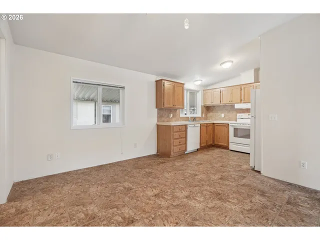 a view of a kitchen with a sink cabinets and a window