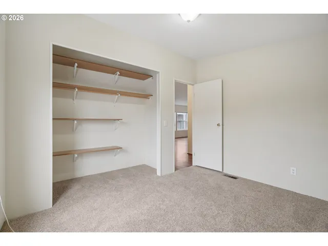 a bathroom with a sink toilet a mirror and shower