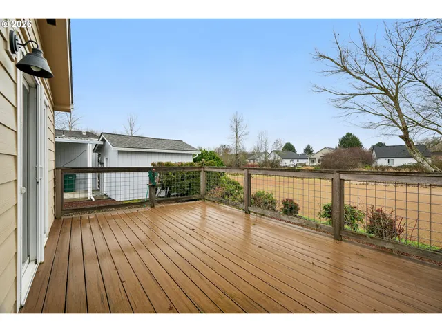 a view of outdoor space with deck and hardwood