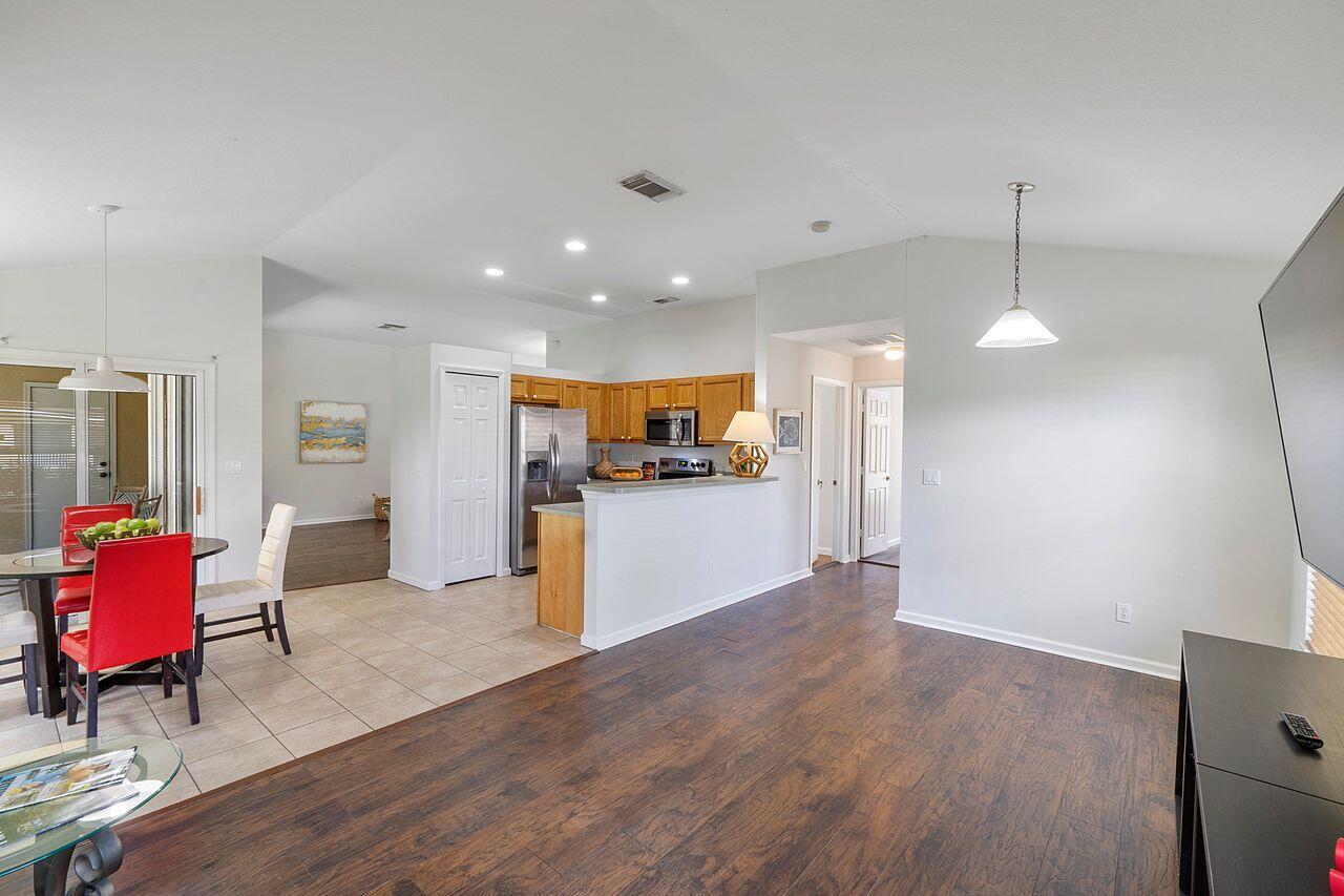 2655 Southwest Ace Road Port St. Lucie, FL 34953 - Photo 23 of 43 Family Room into Kitchen