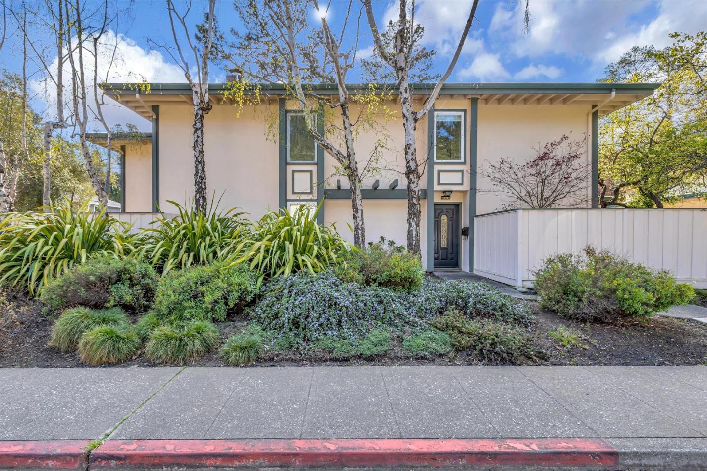 a view of a house with a street