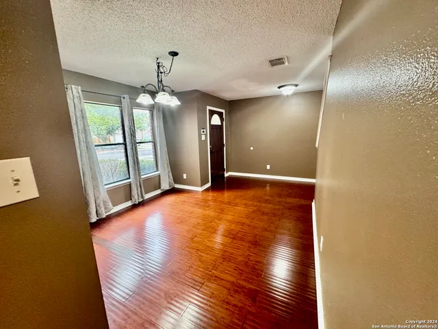 a view of a livingroom with wooden floor