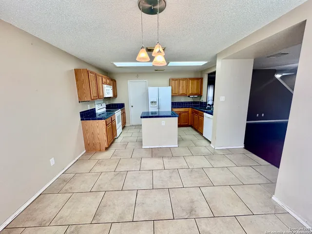 a living room with a table and chairs