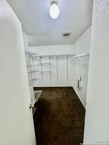 view of a room with rack on the wall