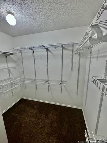 a view of a room with racks on the wall