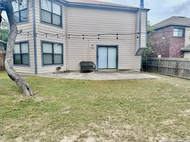 a house with swimming pool in front of it