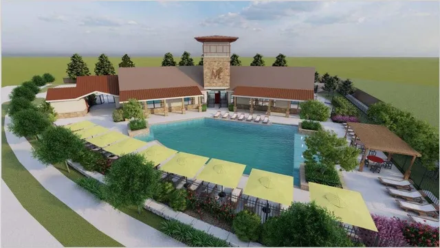 an aerial view of a house with garden space and street view