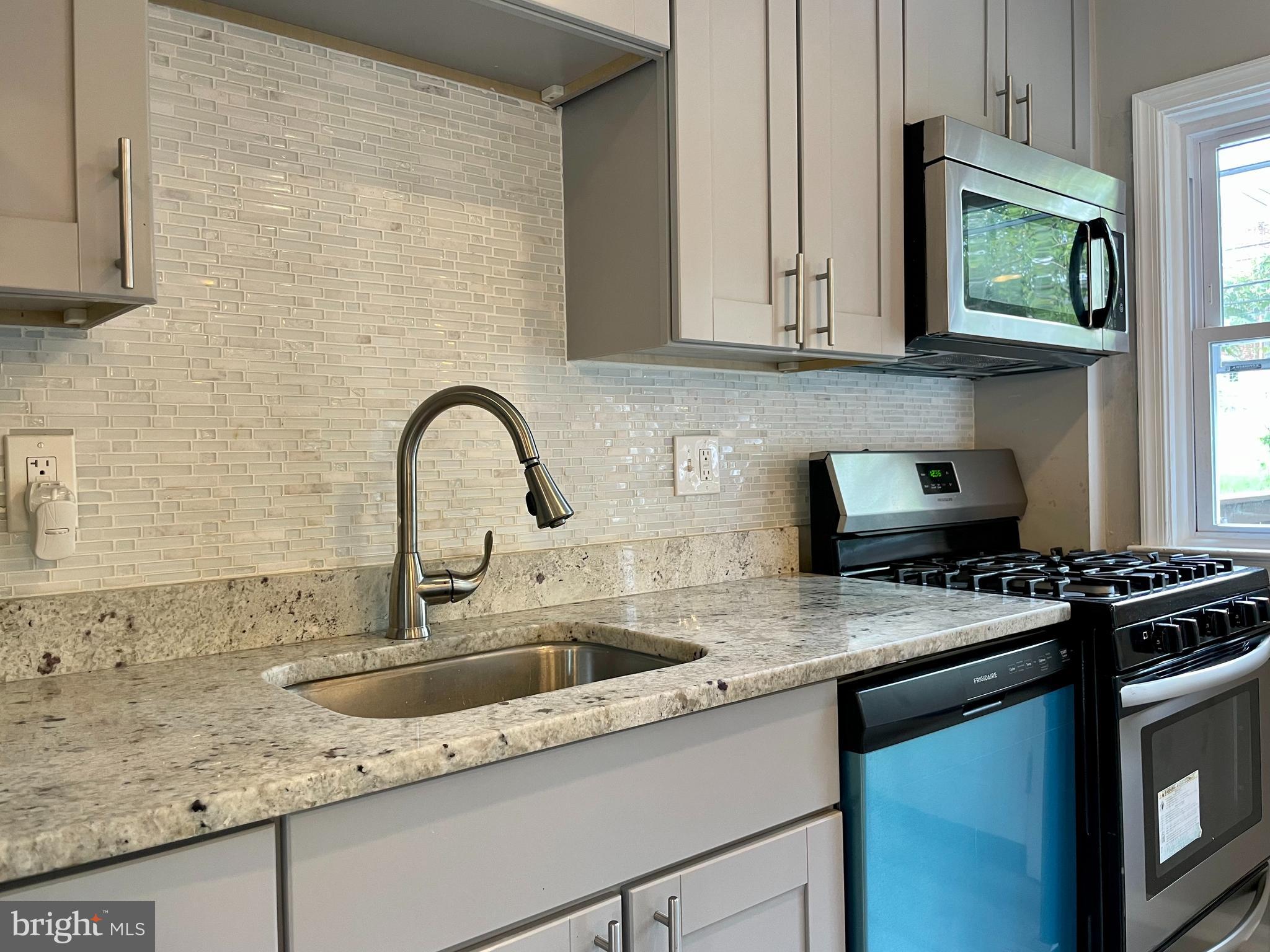 1634 Northgate Road Baltimore, MD 21218 - Photo 7 of 30 Stunning backsplash, updated fixtures