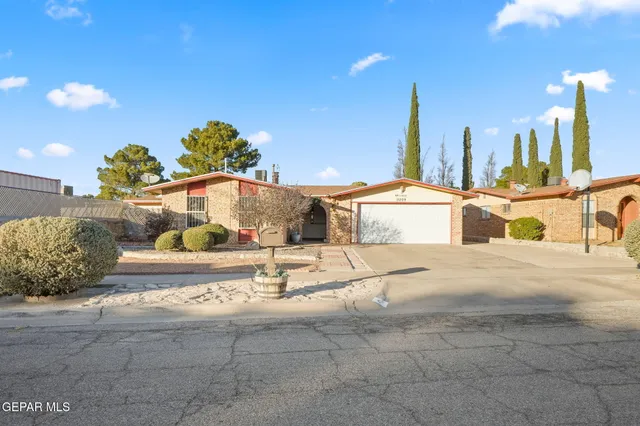 a view of a house with a snow on the road