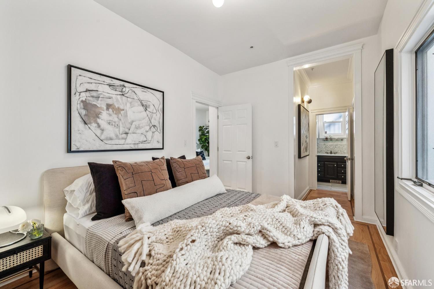 729 Douglass Street, Unit A San Francisco, CA 94114 - Photo 36 of 56 a bed room with a bed and painting on the wall