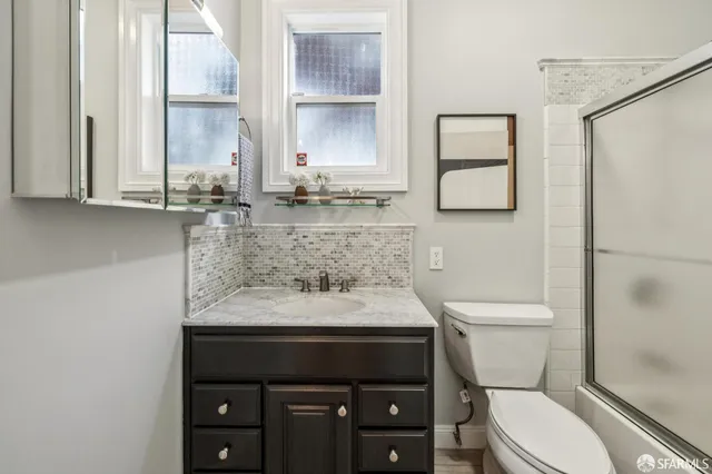 a view of backyard with seating space and trees