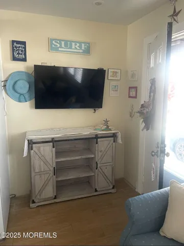 a living room with a couch and a flat screen tv