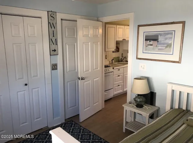 a view of kitchen with cabinets
