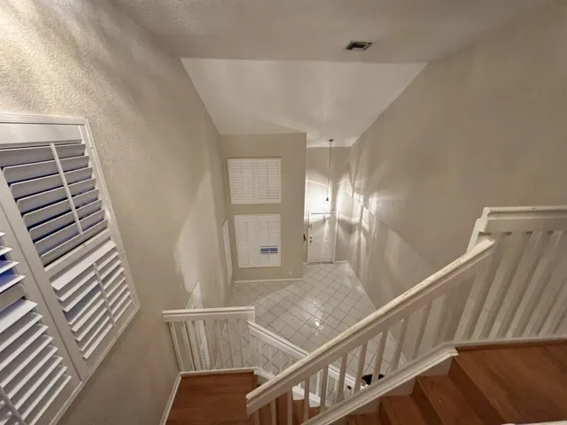 a view of an entryway with a small yard