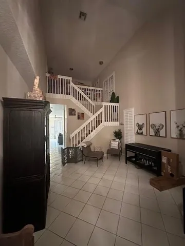 a living room with furniture and a table