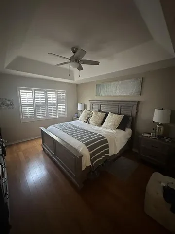 a bedroom with bed and window