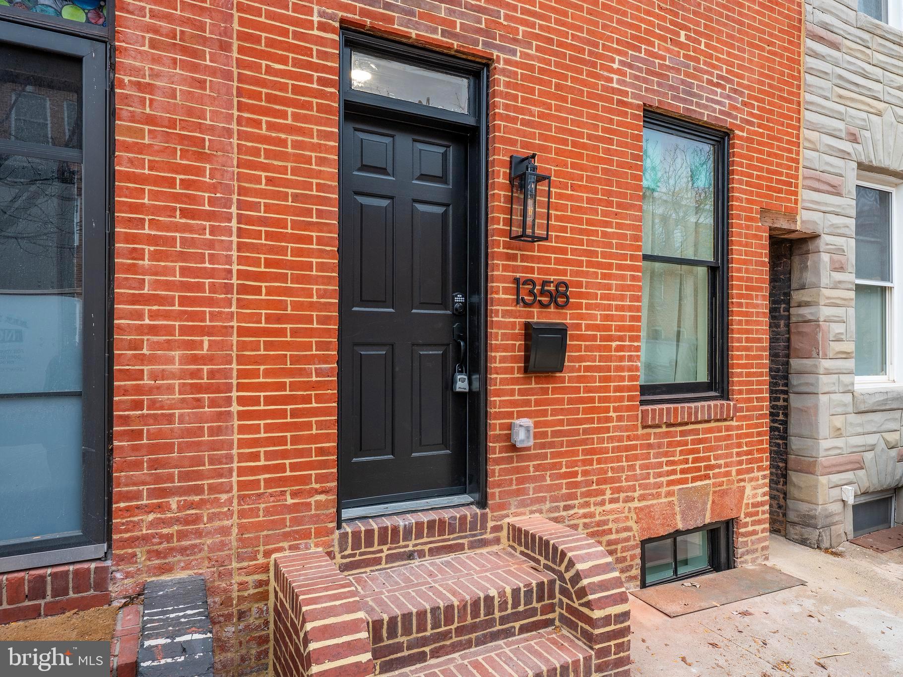 a brick building with a door and a window