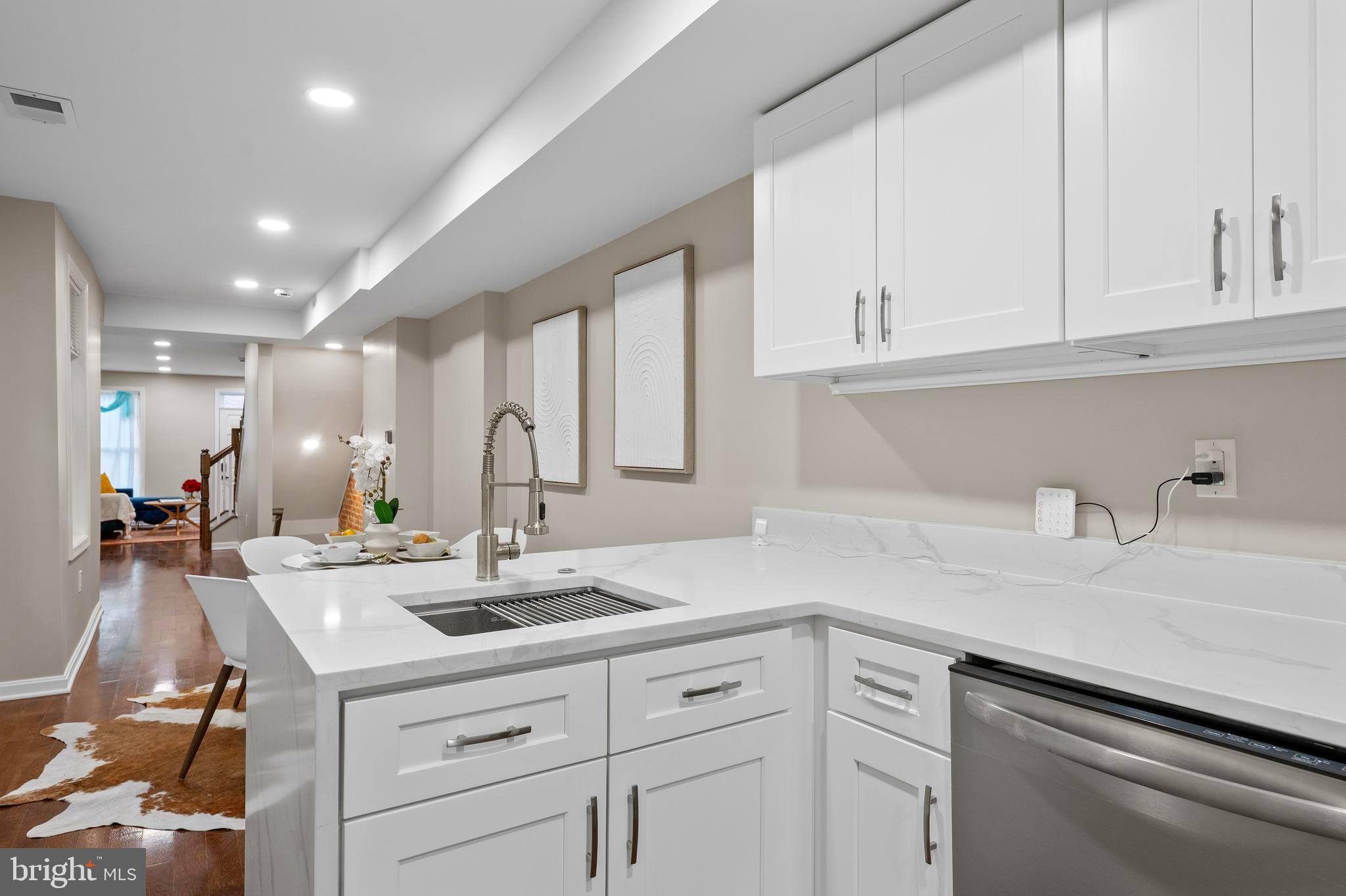 1358 Towson Street Baltimore, MD 21230 - Photo 15 of 51 a kitchen with kitchen island a sink and cabinets