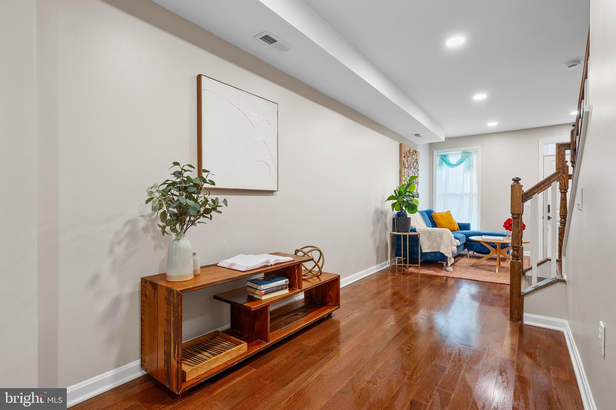 1358 Towson Street Baltimore, MD 21230 - Photo 6 of 51 a living room with furniture and a potted plant