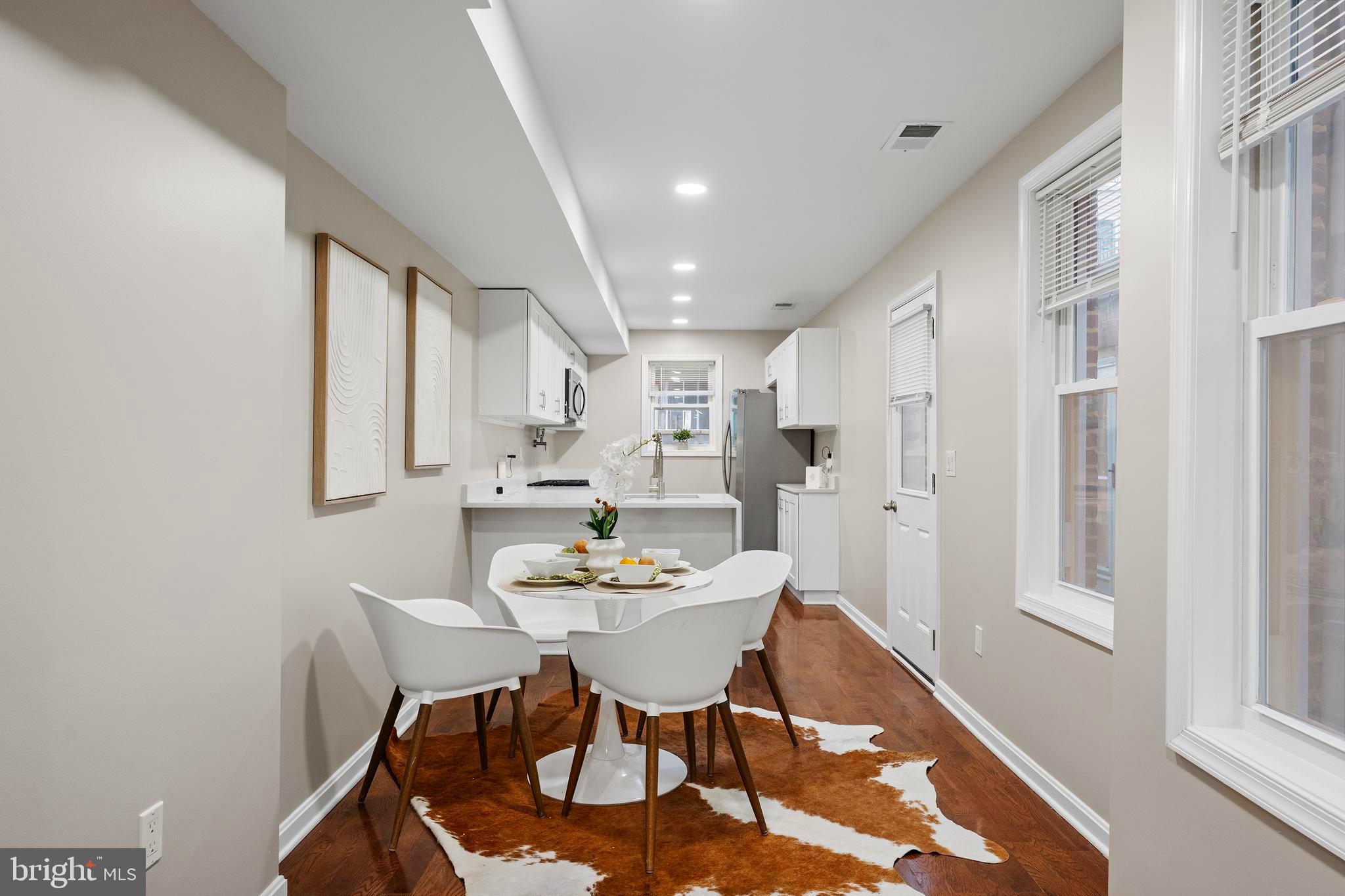 1358 Towson Street Baltimore, MD 21230 - Photo 7 of 51 a view of a dining room with furniture and wooden floor