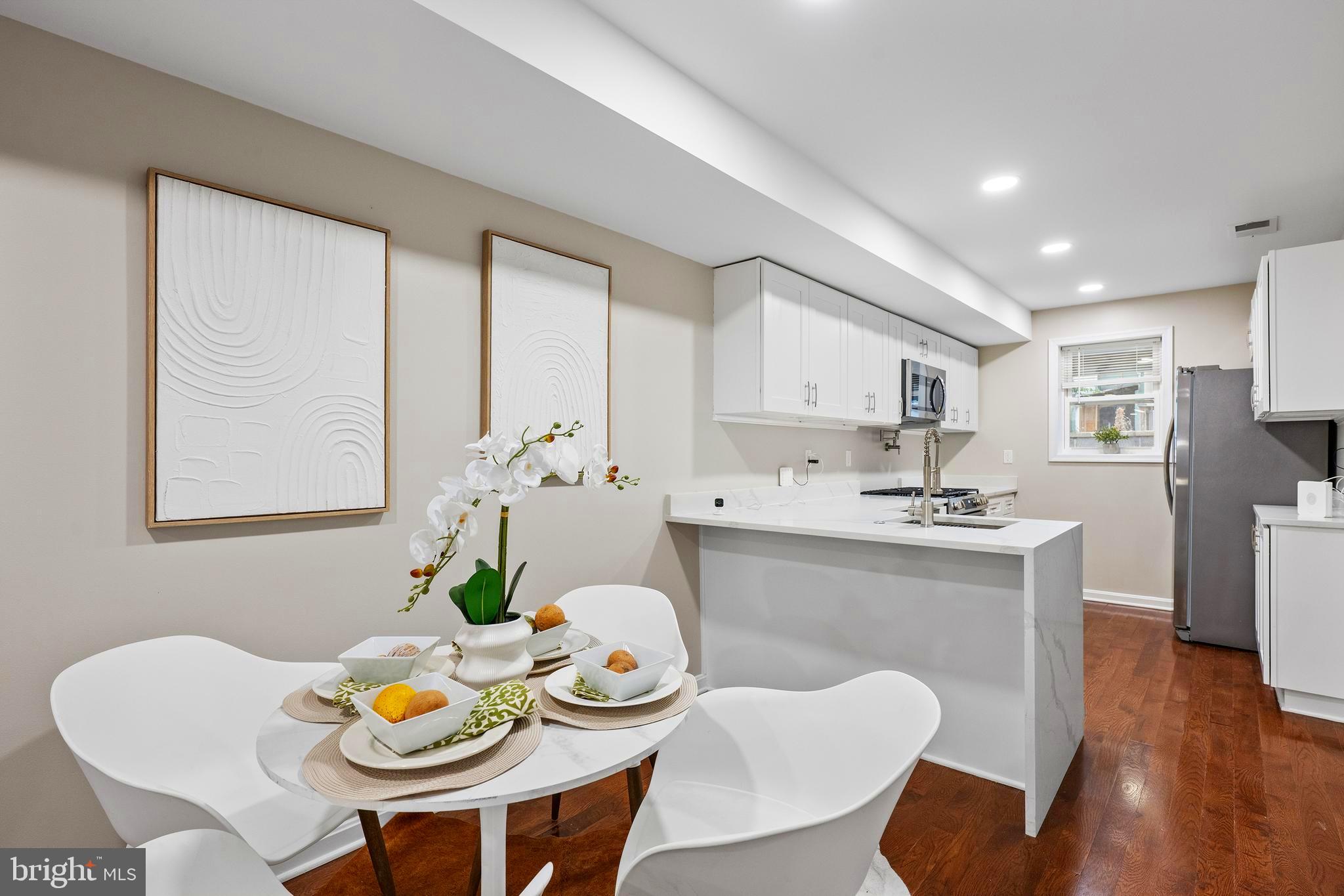 1358 Towson Street Baltimore, MD 21230 - Photo 8 of 51 a view of a dining room with furniture and wooden floor