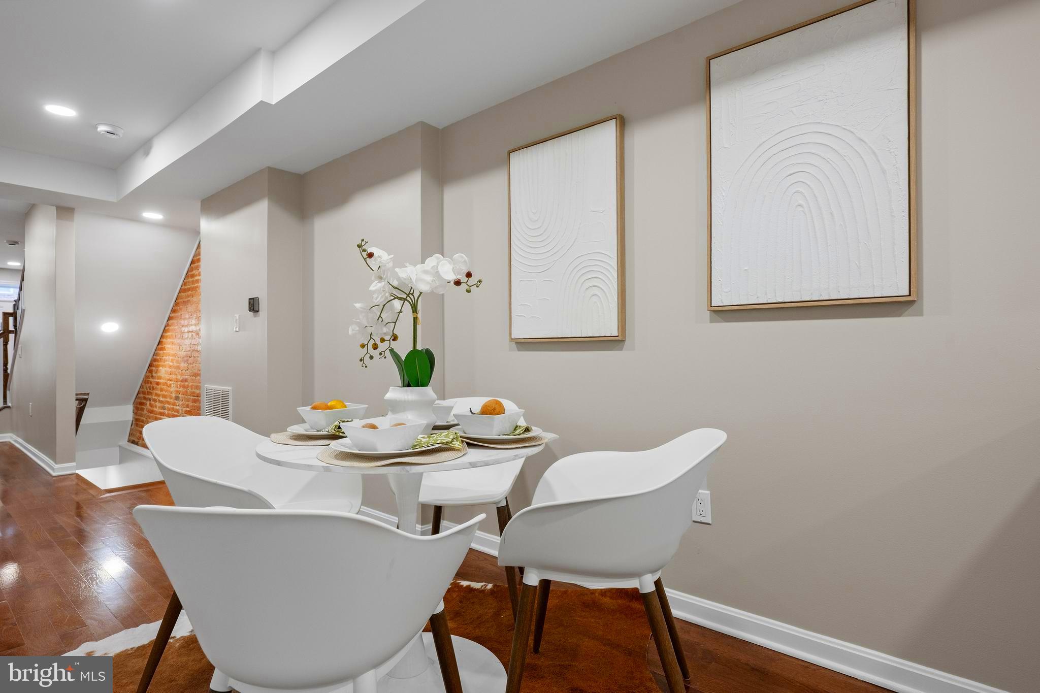 1358 Towson Street Baltimore, MD 21230 - Photo 9 of 51 a dining room with furniture and wooden floor