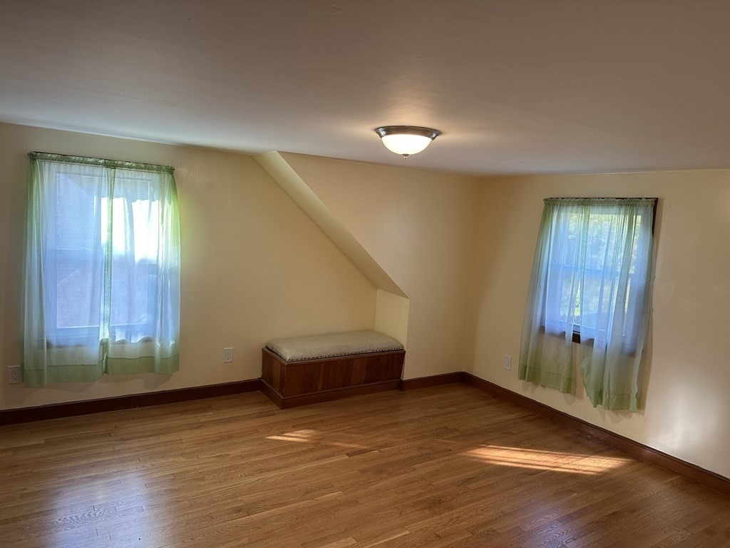 20 Eames Street North Reading, MA 01864 - Photo 12 of 13 a view of an empty room with wooden floor and a window