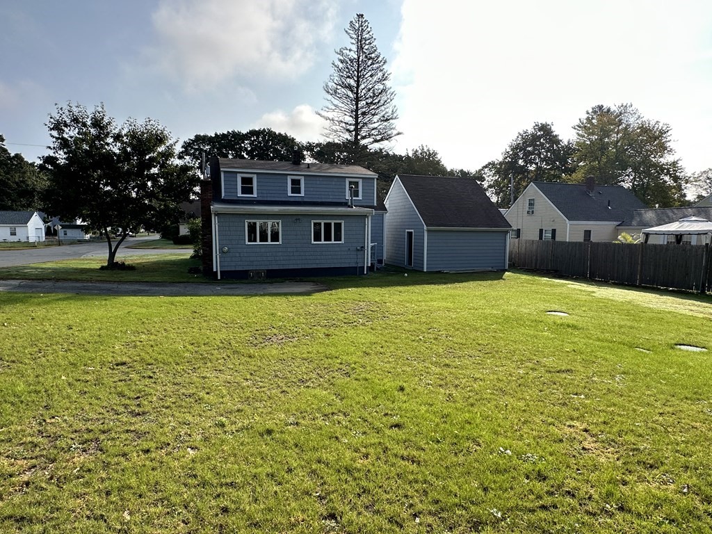 20 Eames Street North Reading, MA 01864 - Photo 3 of 13 a swimming pool is sitting in front of a house with a yard
