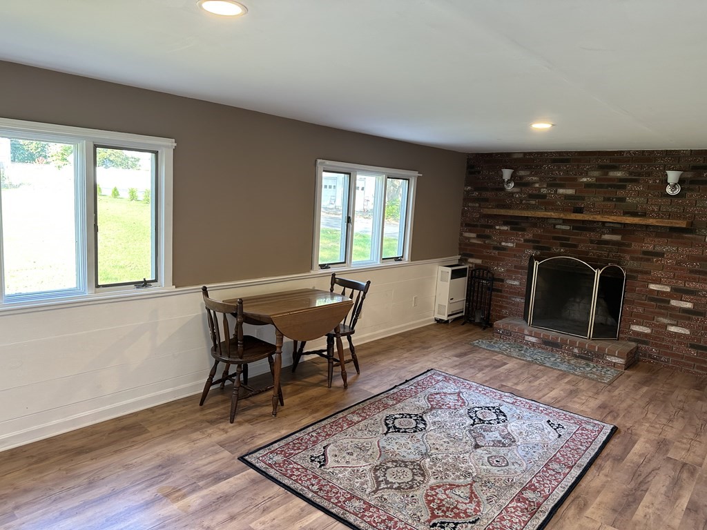20 Eames Street North Reading, MA 01864 - Photo 9 of 13 a living room with furniture and a fireplace