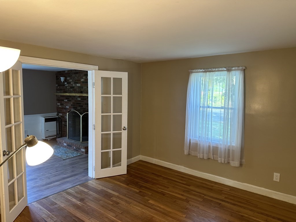 20 Eames Street North Reading, MA 01864 - Photo 10 of 13 wooden floor in an empty room with a window