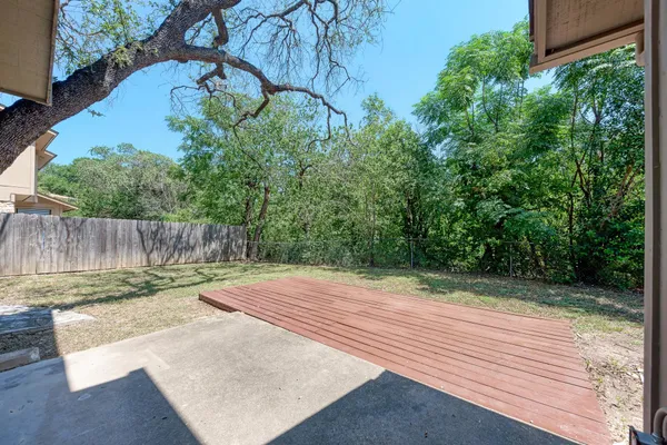 a view of a backyard with sitting area