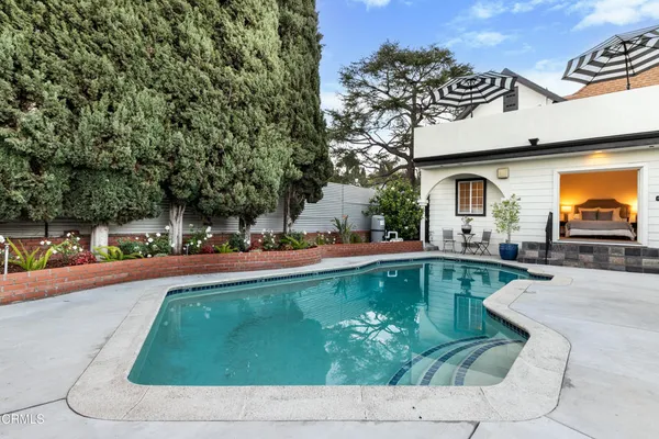 a view of a swimming pool with a patio