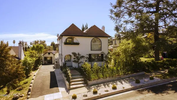 an aerial view of residential houses with city view