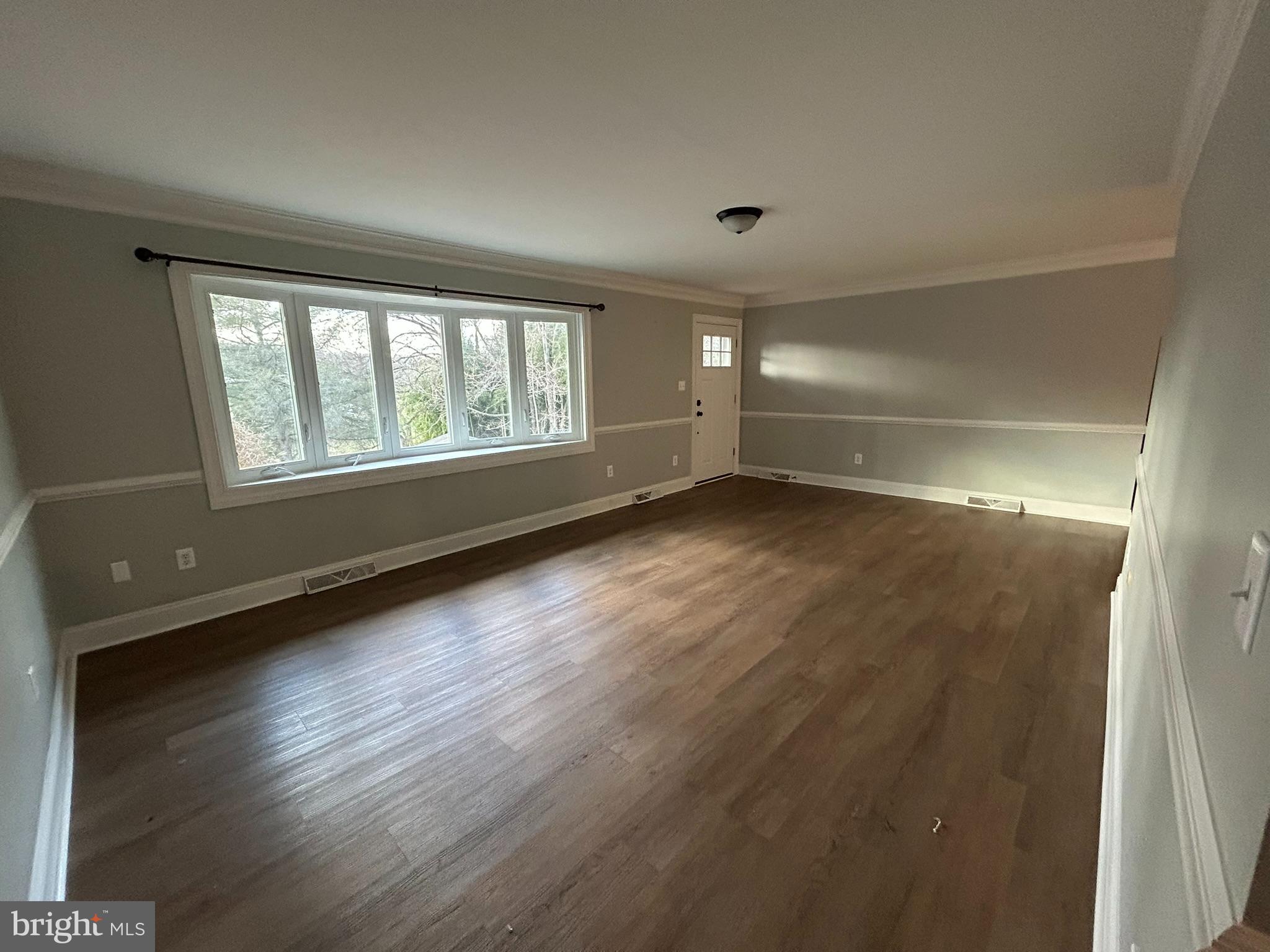 136 Cedar Knoll Road Coatesville, PA 19320 - Photo 12 of 28 an empty room with wooden floor and windows