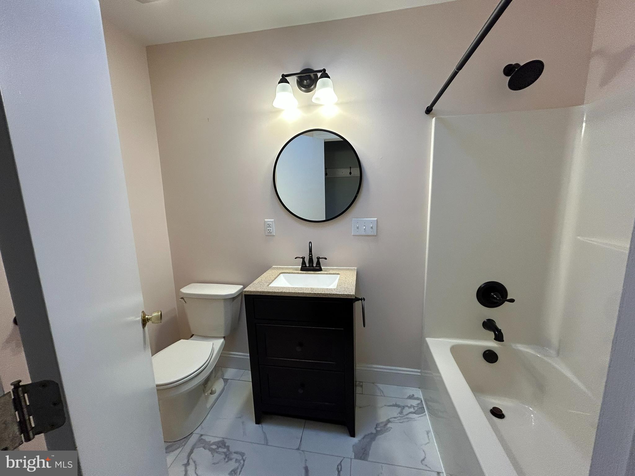 136 Cedar Knoll Road Coatesville, PA 19320 - Photo 14 of 28 a bathroom with a sink a toilet and shower