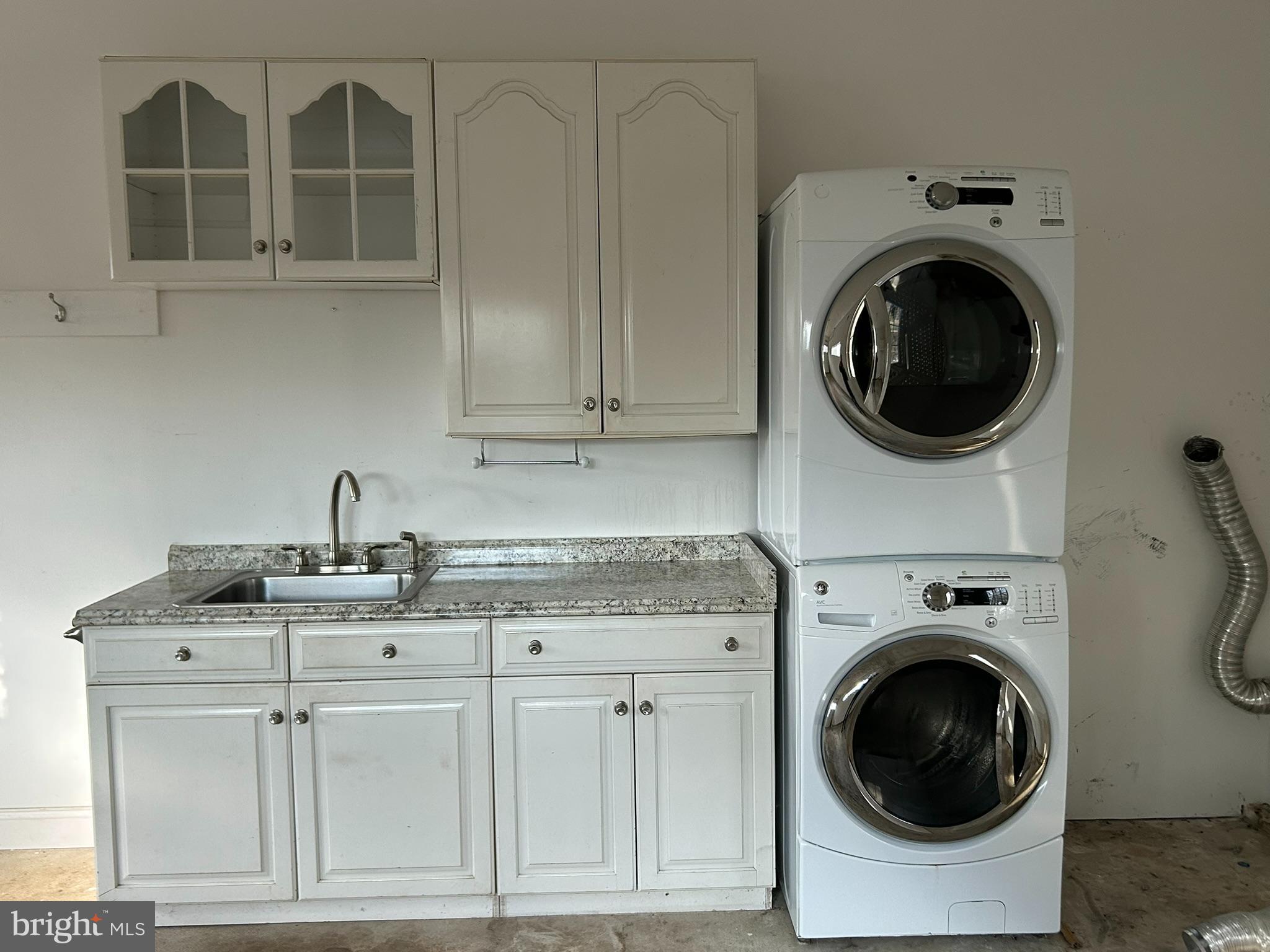 136 Cedar Knoll Road Coatesville, PA 19320 - Photo 21 of 28 a utility room with sink dryer and washer