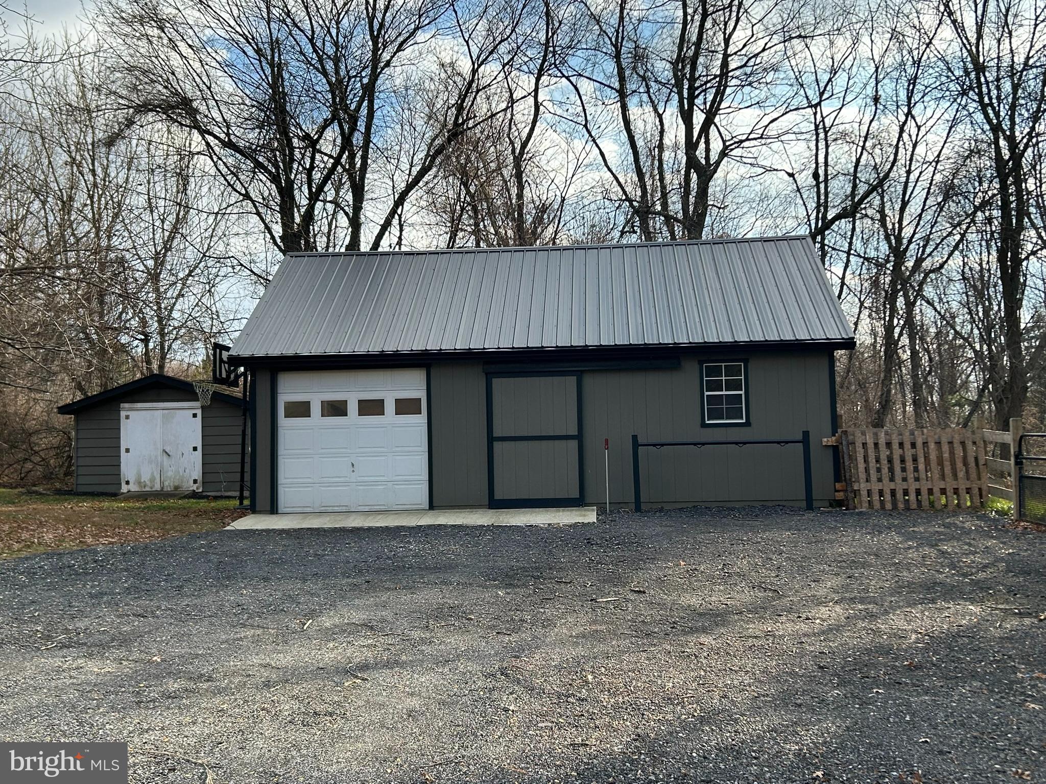 136 Cedar Knoll Road Coatesville, PA 19320 - Photo 24 of 28 a view of a house with a yard and garage