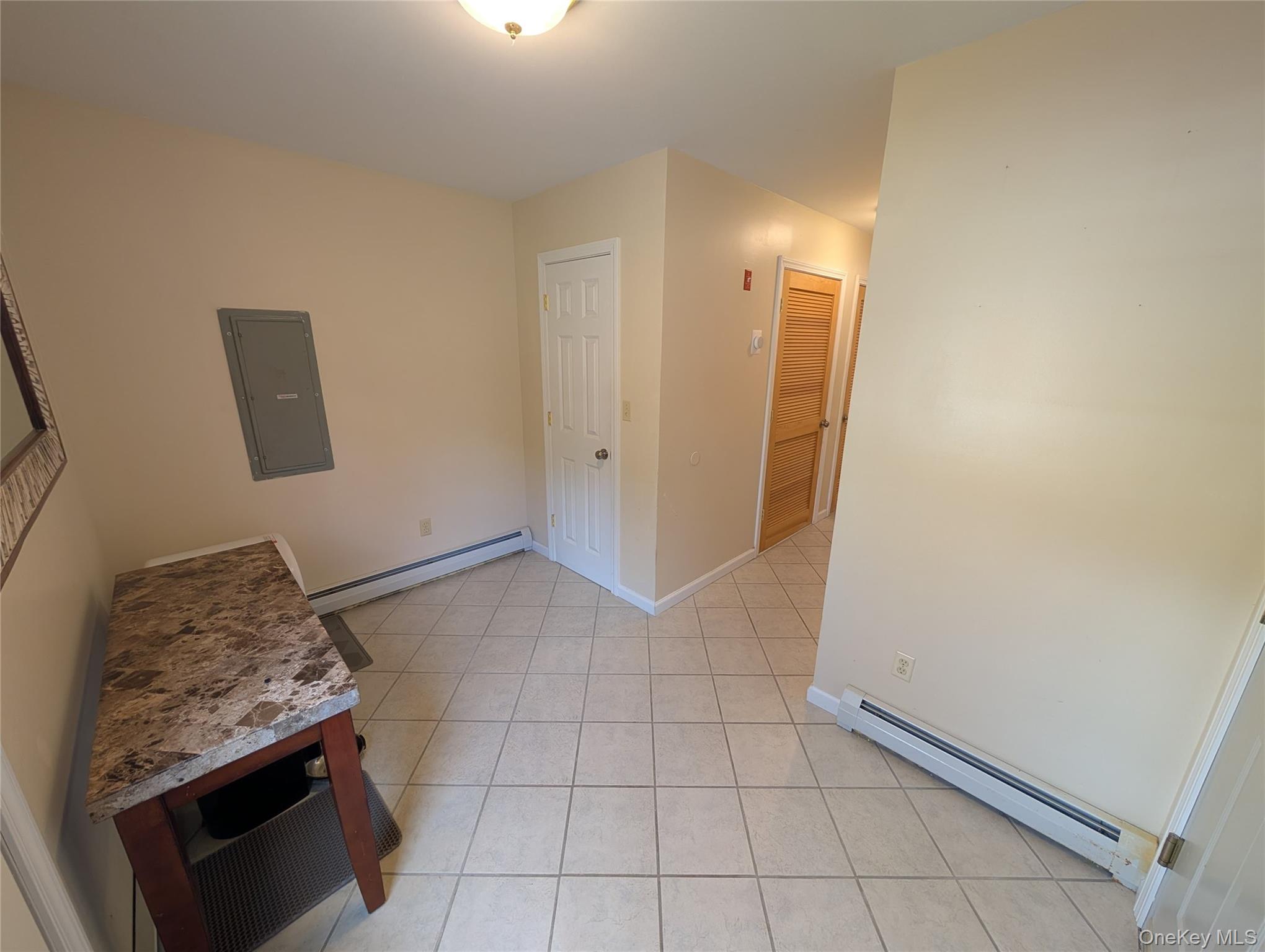 5 Equestrian Acres Lane Brewster, NY 10509 - Photo 11 of 50 a view of an empty room and wooden floor