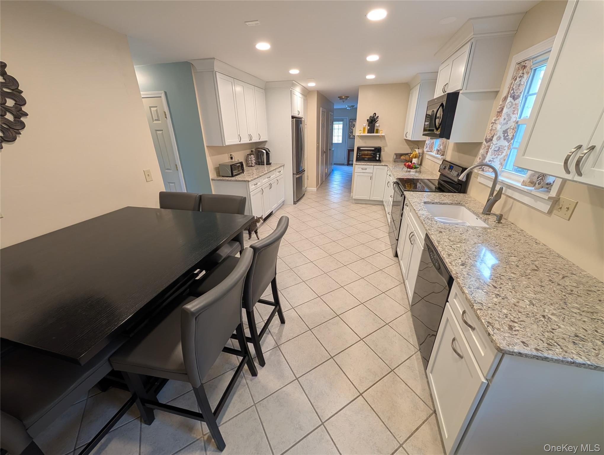 5 Equestrian Acres Lane Brewster, NY 10509 - Photo 13 of 50 a large kitchen with a table and chairs