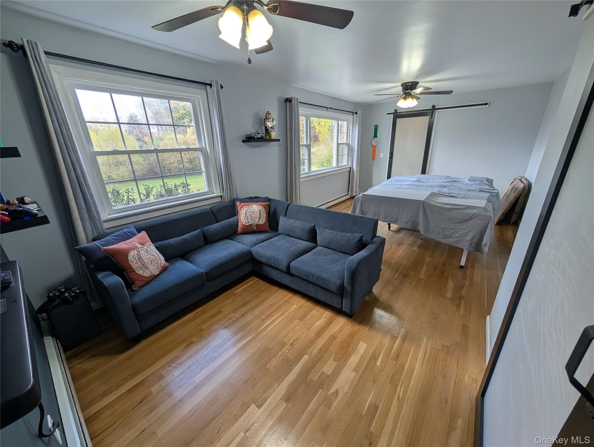 5 Equestrian Acres Lane Brewster, NY 10509 - Photo 16 of 50 a living room with furniture and a window