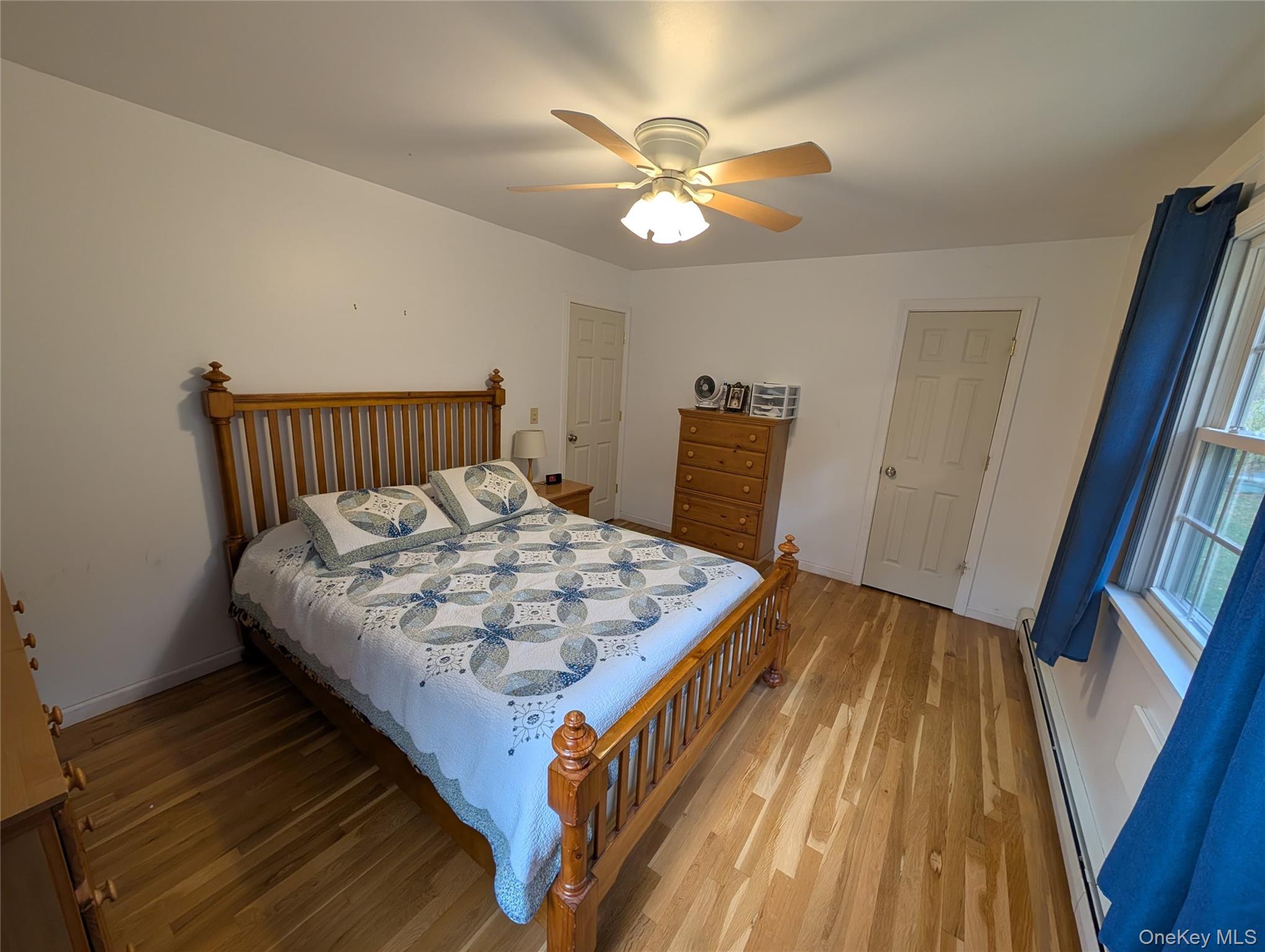 5 Equestrian Acres Lane Brewster, NY 10509 - Photo 30 of 50 a bedroom with a bed and wooden floor