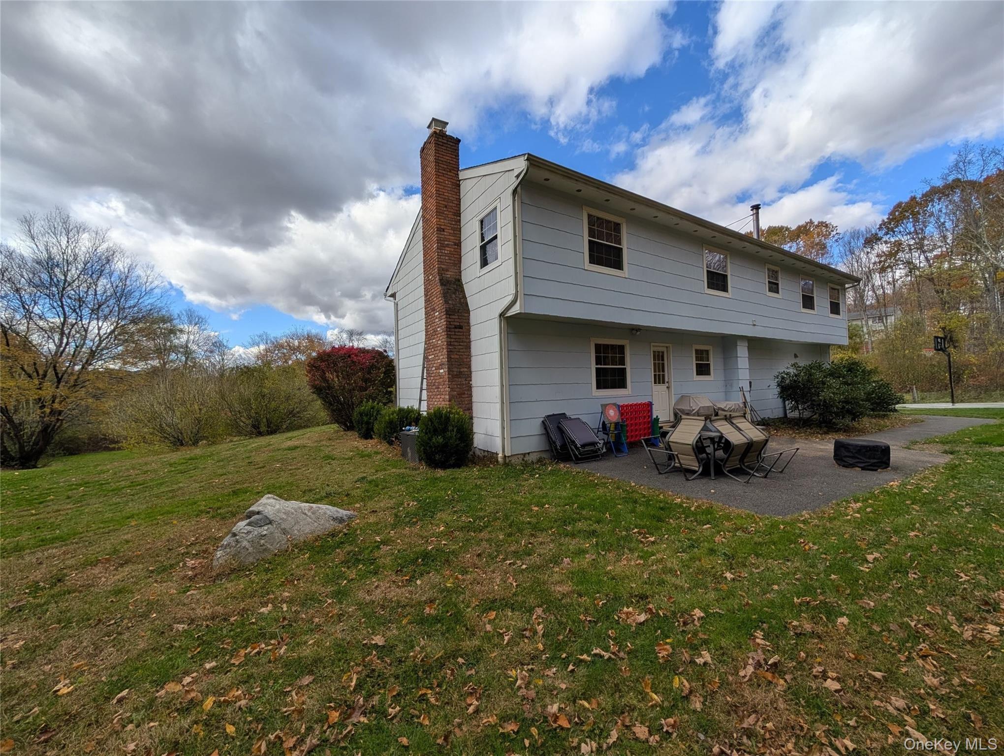 5 Equestrian Acres Lane Brewster, NY 10509 - Photo 4 of 50 a view of a house with backyard