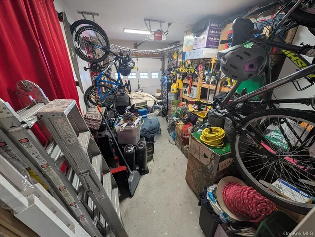 a view of walk in closet with clothes