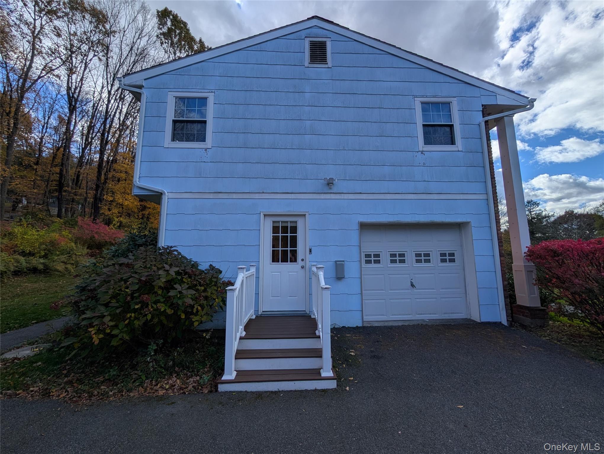 5 Equestrian Acres Lane Brewster, NY 10509 - Photo 7 of 50 a front view of a house with a yard