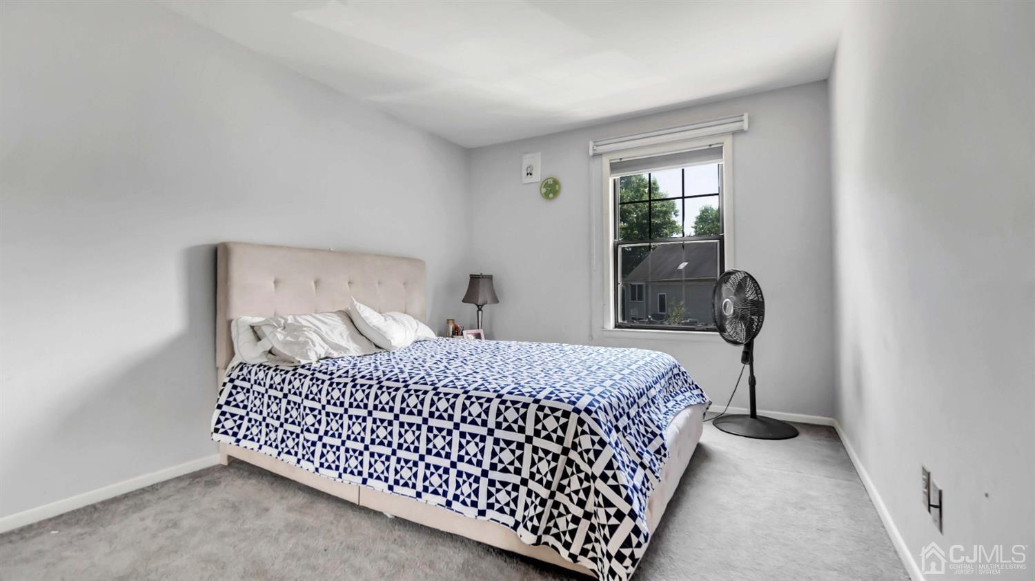 3404 Springbrook Drive Edison, NJ 08820 - Photo 25 of 32 a bedroom with a bed and wooden floor