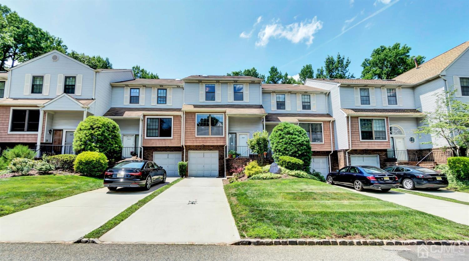 3404 Springbrook Drive Edison, NJ 08820 - Photo 5 of 32 a front view of a residential apartment building with a yard